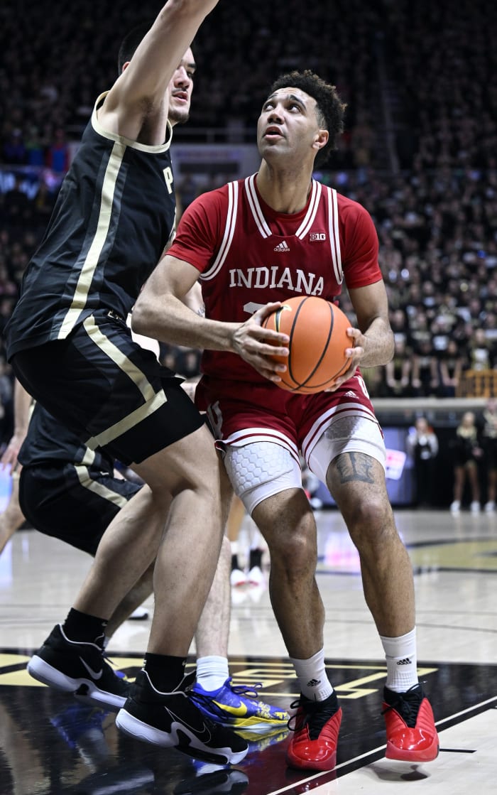 Trayce Jackson-Davis (23) controls the ball against Purdue Boilermakers center Zach Edey (15).